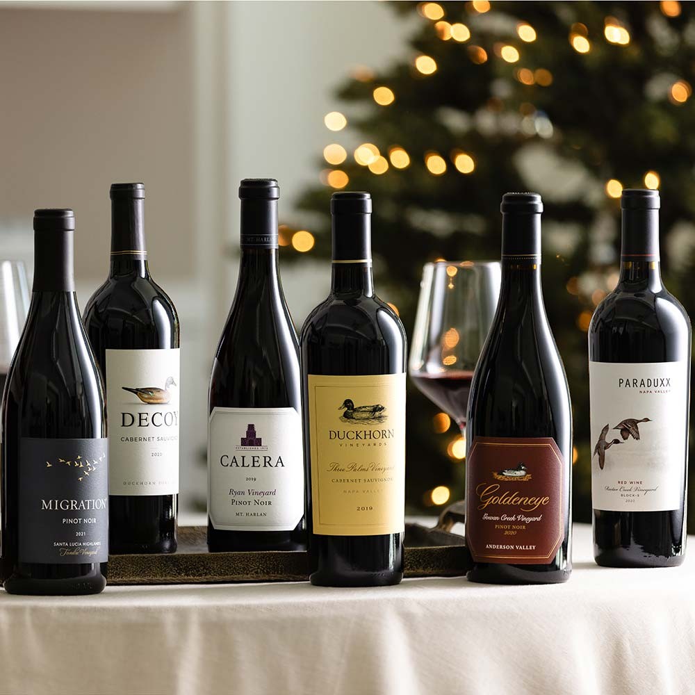 Selection of duckhorn portfolio wines with Christmas tree background